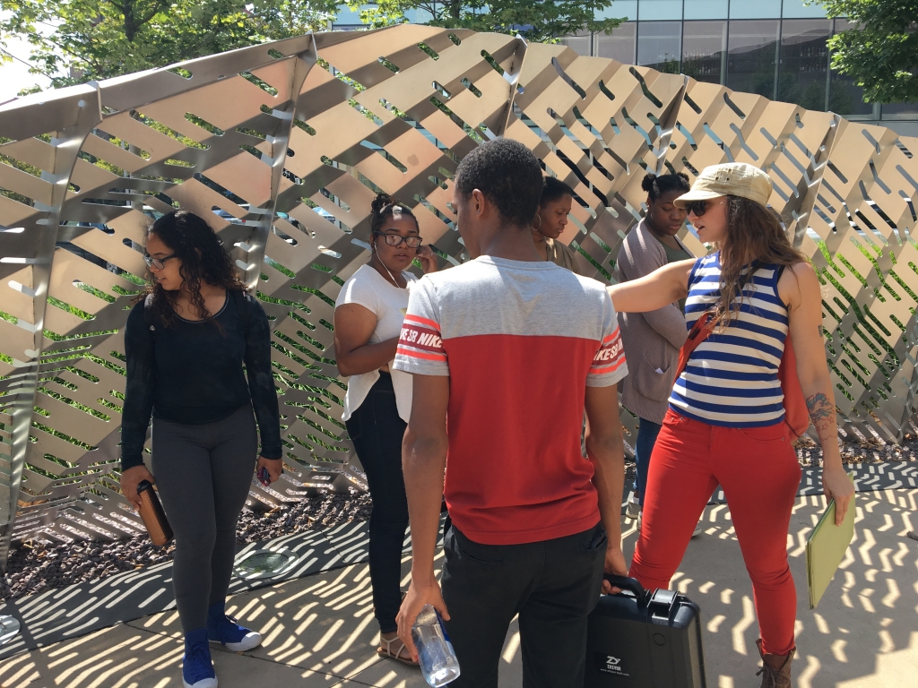 Touring public art in downtown Providence—students walk alongside Mikyoung Kim's Horizon Garden at the southwest corner of Dunkin' Donuts Center on Sabin Street. Photo by Margie Butler