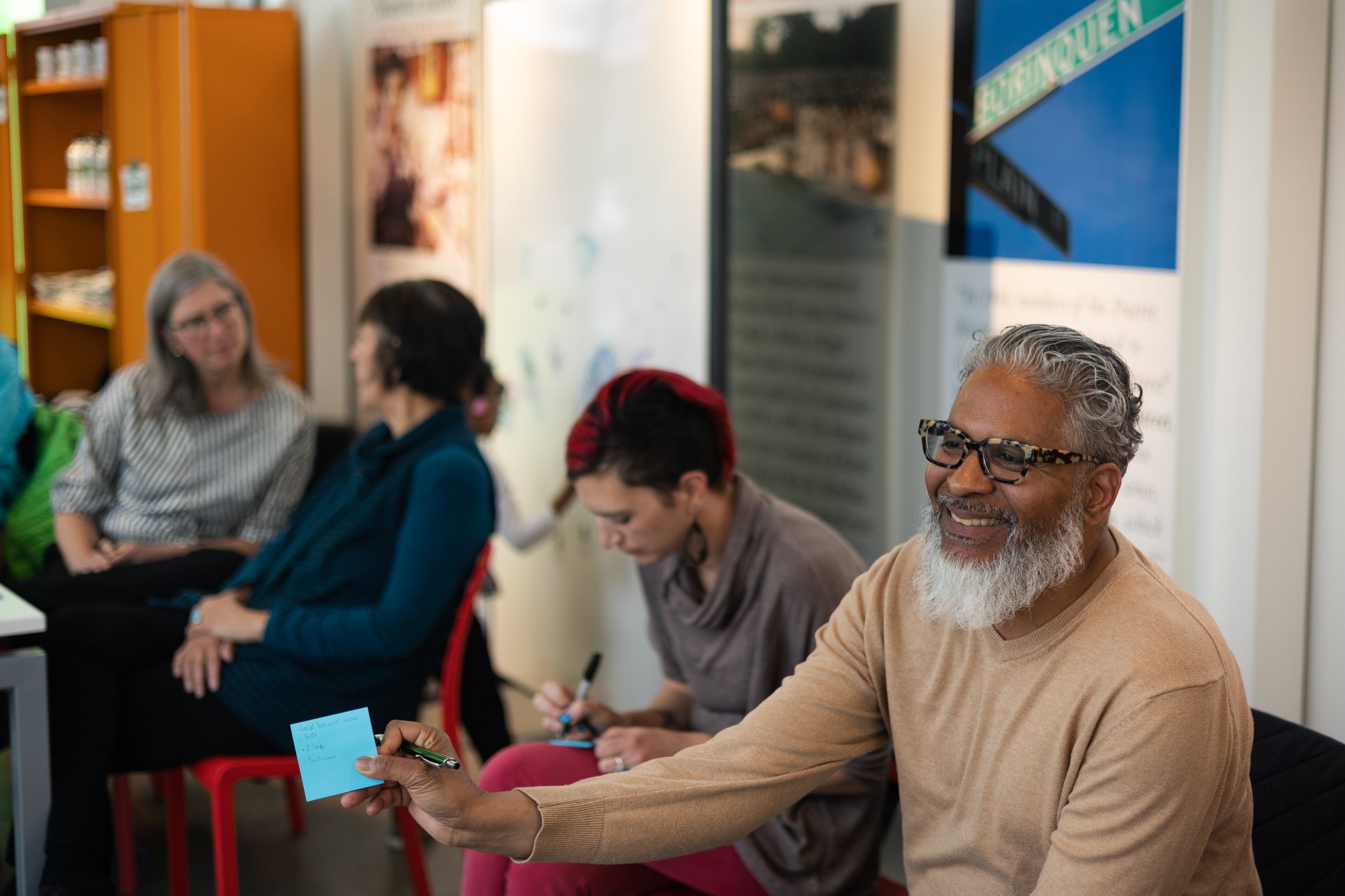 photo of people during a broad street stories meeting