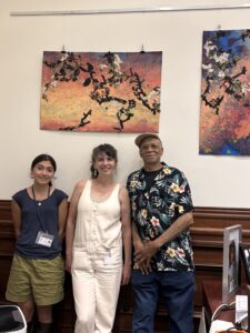 The installation crew poses in front of Bob's artwork.