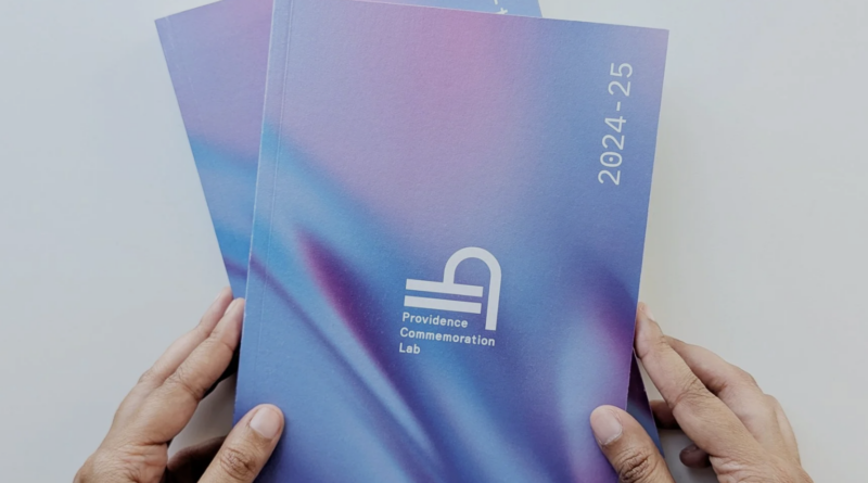 Two hands holding the blue PCL book